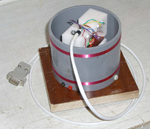 The sensor head sitting inside the Helmholtz calibration
		coils.